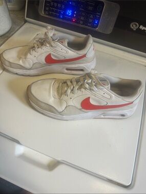 Nike White Sneakers with Red Swoosh and Light Gray Accents